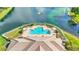 Resort-style community pool with a sundeck and lake view at 8288 Lake James Dr, Lakeland, FL 33810