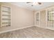 Bright home office with built-in shelving and hardwood flooring at 8288 Lake James Dr, Lakeland, FL 33810