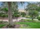 Landscaped community park with benches and flagpole at 8288 Lake James Dr, Lakeland, FL 33810