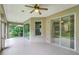 Relaxing screened porch with sliding doors and ceiling fan at 8288 Lake James Dr, Lakeland, FL 33810
