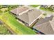Aerial view of a house and neighborhood by the lake at 8288 Lake James Dr, Lakeland, FL 33810