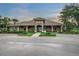 Lake James clubhouse with stone exterior and landscaping at 8288 Lake James Dr, Lakeland, FL 33810