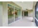 Spacious screened porch with sliding glass doors and tile flooring at 8288 Lake James Dr, Lakeland, FL 33810