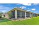 Single-story house with screened porch and landscaped yard at 8288 Lake James Dr, Lakeland, FL 33810