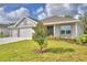 Two-car garage and nicely landscaped yard at 5500 Knights Landing Dr, Lakeland, FL 33810