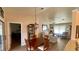 Dining area with wooden table and access to living room and bedroom at 5879 Swallow Dr, Lakeland, FL 33809