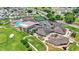 Aerial view of community amenities including pool and golf course at 5879 Swallow Dr, Lakeland, FL 33809