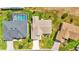 Overhead view of houses with swimming pools in a residential area at 5879 Swallow Dr, Lakeland, FL 33809