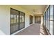 Spacious screened porch with sliding glass doors and ceiling fan at 5879 Swallow Dr, Lakeland, FL 33809