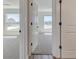 Hallway view of two bedrooms with carpeted floors at 1038 Thompson Ave, Frostproof, FL 33843