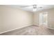 Bright bedroom with ceiling fan and carpet flooring at 2025 Sylvester Rd # C4, Lakeland, FL 33803