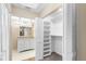 Bright bathroom with a large closet and a vanity with granite countertop at 2025 Sylvester Rd # C4, Lakeland, FL 33803