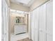 Bathroom features a vanity with granite countertop and ample closet space at 2025 Sylvester Rd # C4, Lakeland, FL 33803