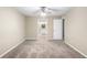 Carpeted bedroom with access to the bathroom at 2025 Sylvester Rd # C4, Lakeland, FL 33803
