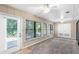 Sunroom with multiple windows, ceiling fan, and access to outdoors at 2025 Sylvester Rd # C4, Lakeland, FL 33803