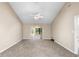 Spacious living room with vaulted ceilings and ceiling fan at 2025 Sylvester Rd # C4, Lakeland, FL 33803