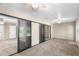 Primary bedroom with mirrored closet doors and carpeting at 2025 Sylvester Rd # C4, Lakeland, FL 33803