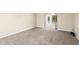 Bright living room featuring carpeting and sliding glass doors at 2025 Sylvester Rd # C4, Lakeland, FL 33803