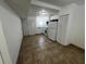 Simple kitchen with white cabinets and tile floor at 143 D St, Lake Wales, FL 33853
