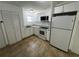 Newly renovated kitchen with white cabinets and granite counters at 143 D St, Lake Wales, FL 33853