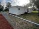 Newly renovated house with a fenced yard and landscaping at 143 D St, Lake Wales, FL 33853