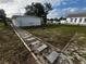 Front yard of the house with a walkway and landscaping at 143 D St, Lake Wales, FL 33853