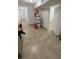 Clean hallway with tile floors and access to other rooms at 143 D St, Lake Wales, FL 33853