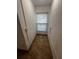 Small storage room with tile floors and a window at 143 D St, Lake Wales, FL 33853