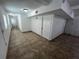 Clean hallway with tile flooring and access to multiple rooms at 143 D St, Lake Wales, FL 33853