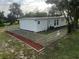 Newly painted house with a fenced-in backyard at 143 D St, Lake Wales, FL 33853