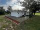 Newly renovated house exterior with fresh paint and landscaping at 143 D St, Lake Wales, FL 33853