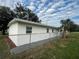 Newly renovated house exterior with fresh paint and landscaping at 143 D St, Lake Wales, FL 33853