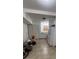 Simple kitchen with white cabinets and appliances at 143 D St, Lake Wales, FL 33853