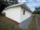 Newly renovated house exterior with fresh paint and landscaping at 143 D St, Lake Wales, FL 33853