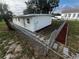 Small house with a fenced yard and newly added landscaping at 143 D St, Lake Wales, FL 33853