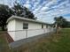 Newly renovated house exterior with fresh paint and landscaping at 143 D St, Lake Wales, FL 33853