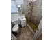 Updated bathroom with shower and tiled flooring at 143 D St, Lake Wales, FL 33853