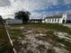 Vacant lot with gravel and potential for new construction at 143 D St, Lake Wales, FL 33853