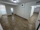 Bright bedroom with tile floors and access to bathroom at 143 D St, Lake Wales, FL 33853