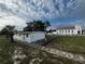Front view of house, showcasing yard and walkway at 143 D St, Lake Wales, FL 33853