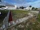 Landscaped front yard with a walkway and newly renovated house at 143 D St, Lake Wales, FL 33853