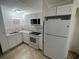 Updated kitchen with white cabinets, new appliances, and granite countertops at 143 D St, Lake Wales, FL 33853