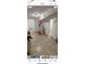 Unfinished hallway with tile floors and paint supplies at 143 D St, Lake Wales, FL 33853