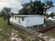 Newly renovated house exterior with fenced yard and landscaping at 143 D St, Lake Wales, FL 33853