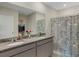 Bathroom with granite countertops, double sinks, and shower/tub combo at 5600 Siltstone St, Lakeland, FL 33811