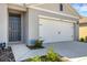 The exterior of a house, featuring a two-car garage and a front door at 5600 Siltstone St, Lakeland, FL 33811