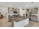 Modern kitchen with gray cabinets, granite countertops, and stainless steel appliances at 5600 Siltstone St, Lakeland, FL 33811
