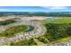 An aerial view showing a neighborhood near a lake at 5600 Siltstone St, Lakeland, FL 33811