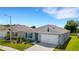 One story home with a two car garage and well maintained lawn at 5600 Siltstone St, Lakeland, FL 33811