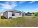 House with large backyard, screened patio, and AC unit at 5600 Siltstone St, Lakeland, FL 33811